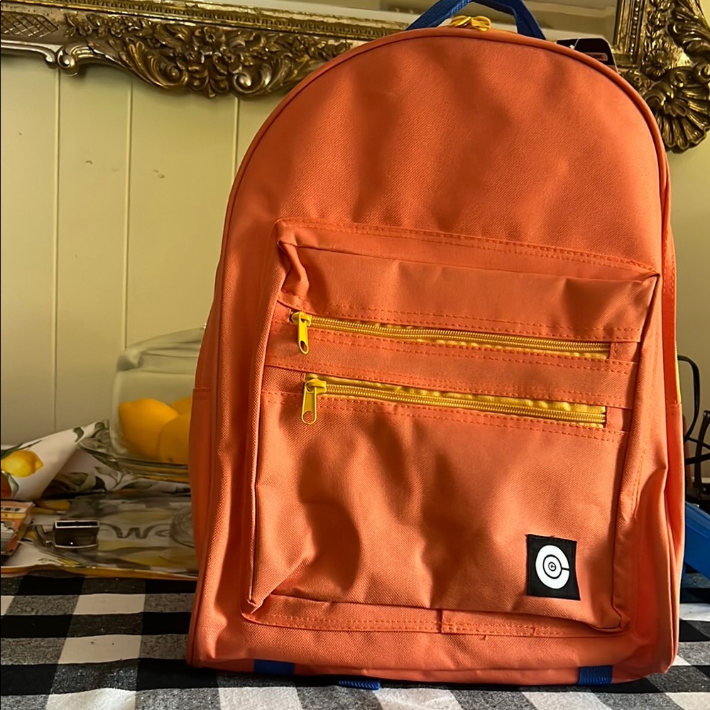 Vibrant Orange Backpack with Yellow Zippers